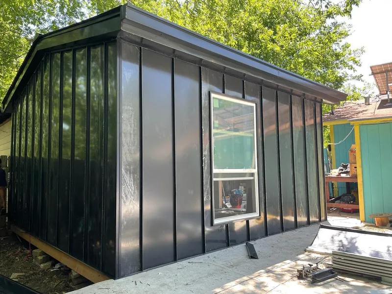 Black standing seam metal wall panels for Roof Inspection in Henniker